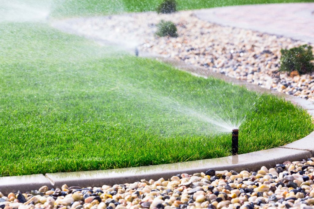 Automatic sprinklers watering lawn